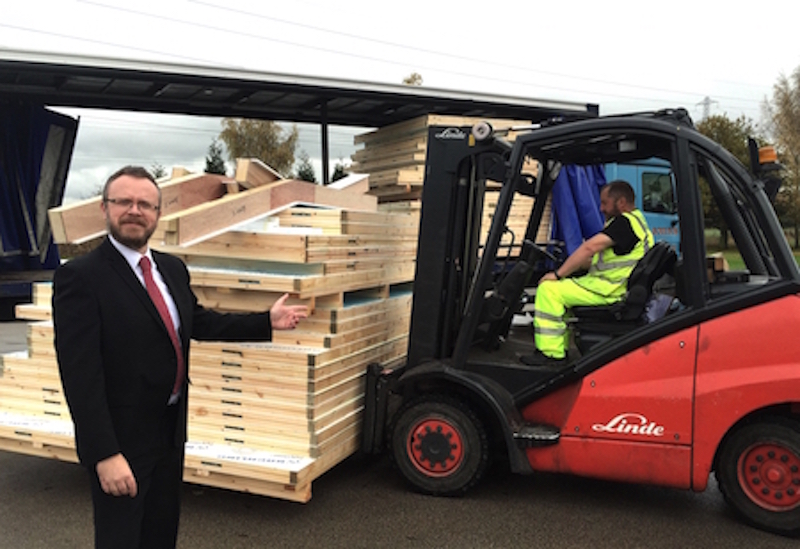 ARM Sales manager, Paul Marland, sees off a piggery in kit form, ready for the pig farmer customer to erect on site