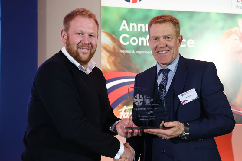 Daniel Fairburn receives his award from Countryfile presenter Adam Henson