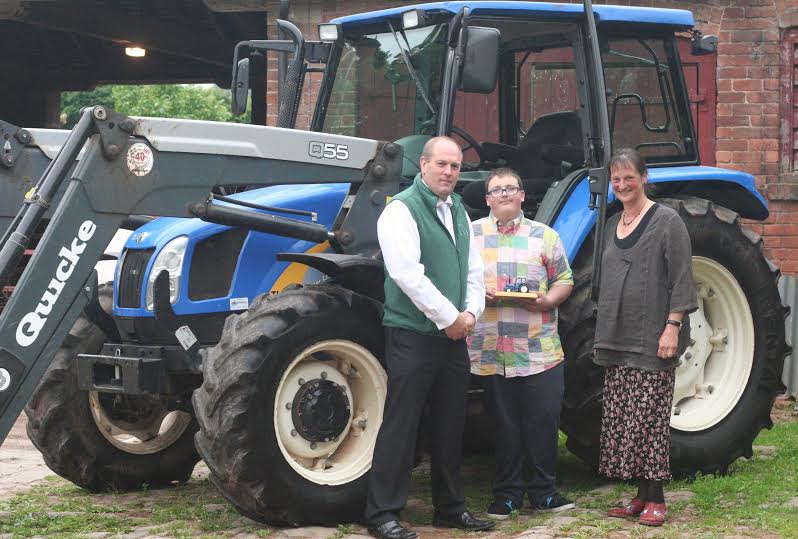 Trevor Scruton and Longlands Care Farm CEO Julia Evans with one of Longlands students, Joel Wrigh