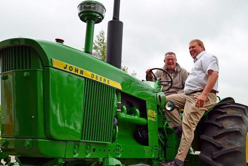 Tony Hales at John Deere HQ, taking the vintange tractor for a spit...