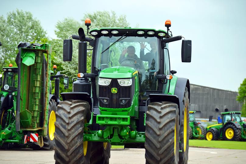 ... he then moves onto a tractor with more of a modern taste