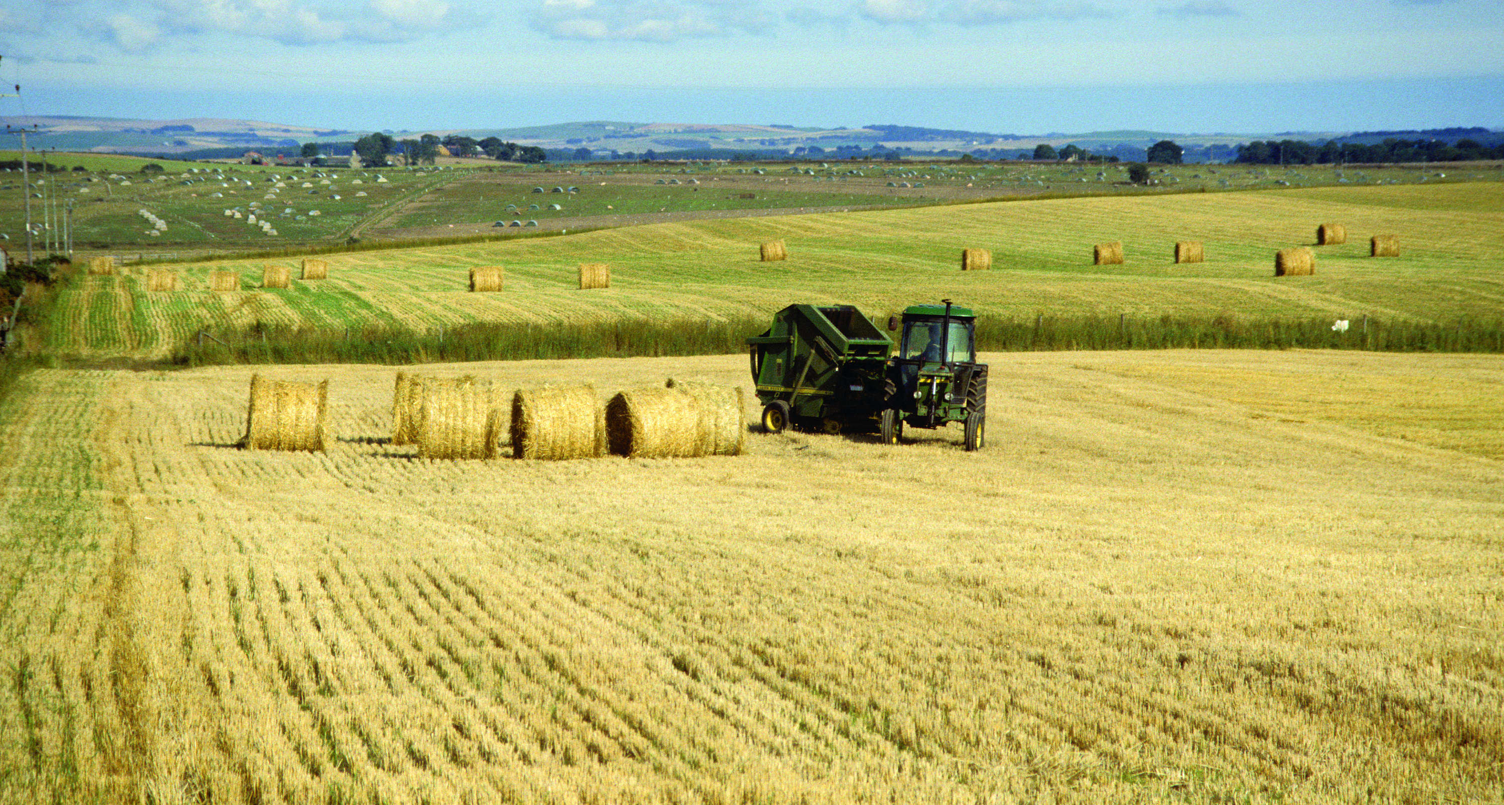 A harvester on a Scottish barley field