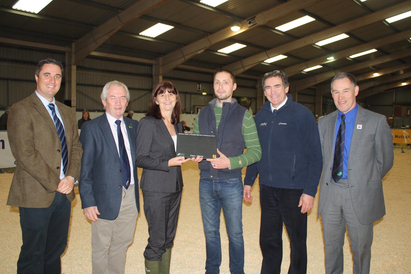 Dairy farmer Iwan Francis accepts his award at the Welsh Dairy Show