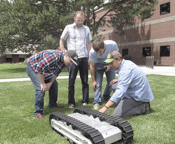 University researchers and students test the low-utility robot farm hand (Photo: Northwest Nazarene University)