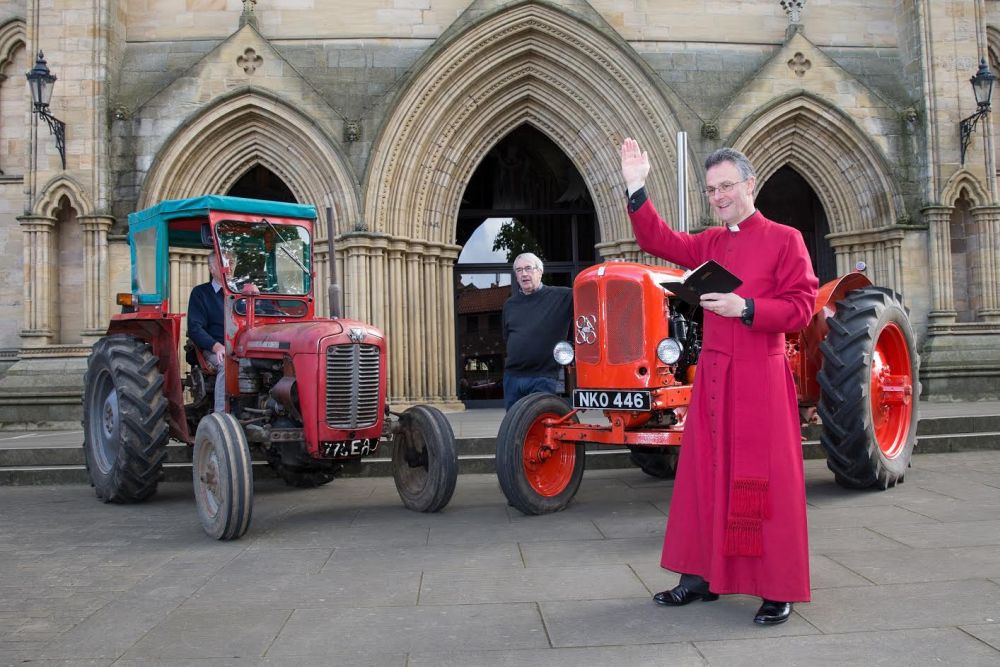 The Very Reverend John Dobson, Dean of Ripon Cathedral blessing the tractors
