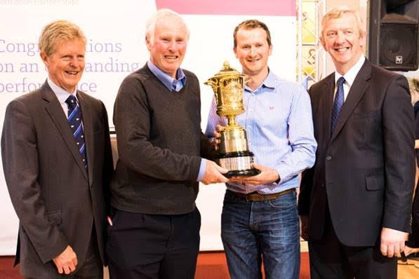 Prof David Leaver, former RABDF president (left) and Philip Kirkham, NMR director (right) presenting Roland and Simon Bugler with the 2016 Gold Cup