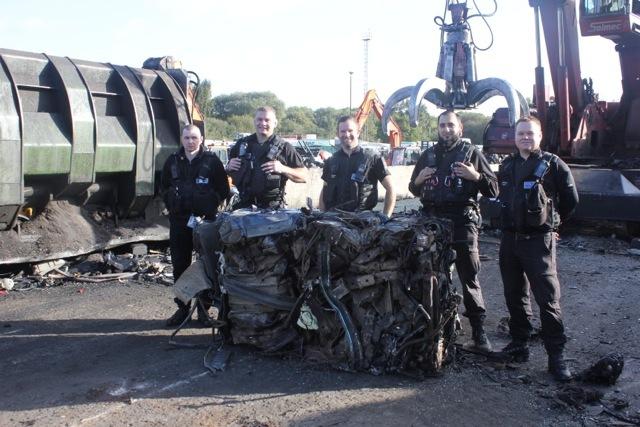 North Yorkshire police with the crushed Land Rover Discovery...