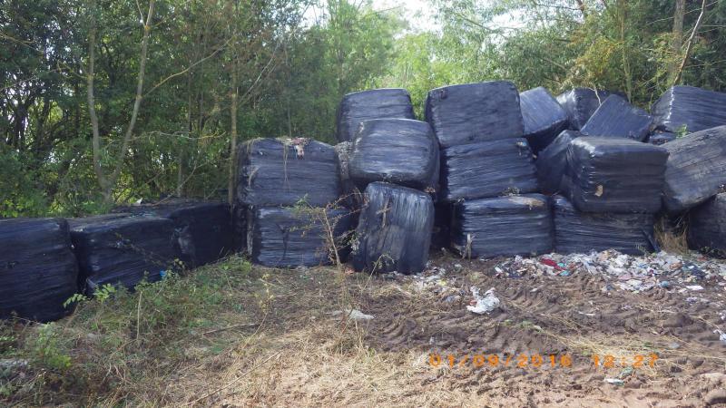 Old processed waste wrapped in 80 black plastic bales and dumped on land without permission (Photo: Environment Agency)