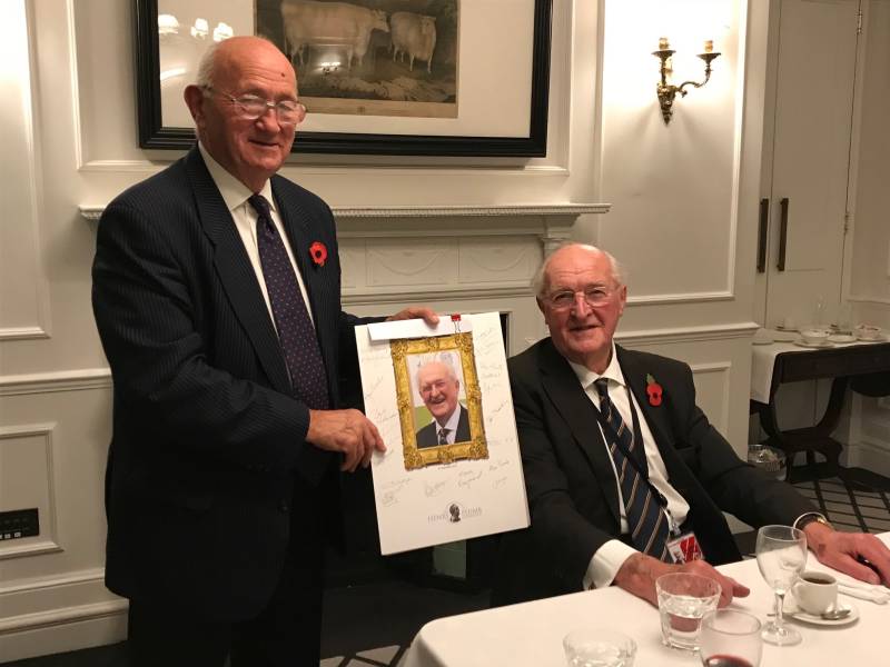 Lord Plumb (right) is presented with a gift at the Farmers Club