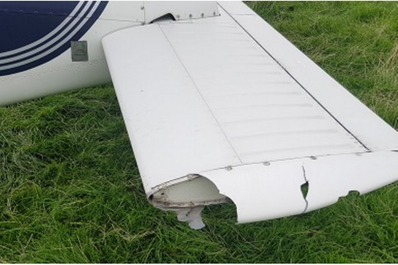 After touchdown the instructor spotted a low fence ahead and briefly lifted the aircraft to “hop” over the fence