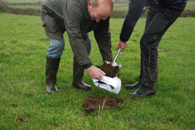 Cornish farmer Mike Harvey burying underpants at Middle Tregerest (Photo: Pete Warman/Cornwall Wildlife Trust)