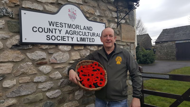 Chairman of Westmorland County Agricultural Society, Stephen Procter with hand-made poppies