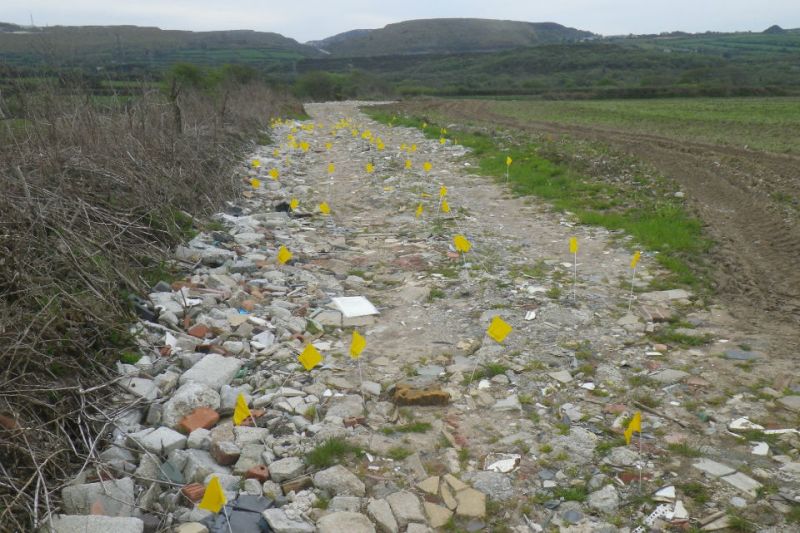 Each yellow flag in this farm track, made from waste supplied by Glebe Quarry Ltd, marks where asbestos was found (Photo: Environment Agency)