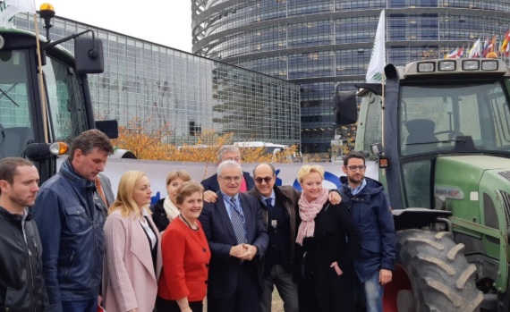 Tractors were parked outside the EU Parliament highlighting the message "CutTheUnfair"