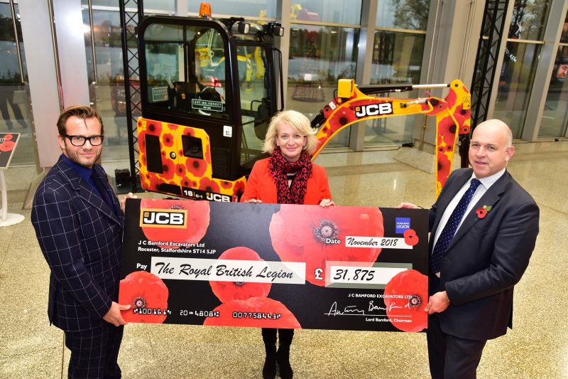 George Bamford (left), presents Annmarie Jones and Simon O'Leary, of the Royal British Legion with a cheque for £31,87
