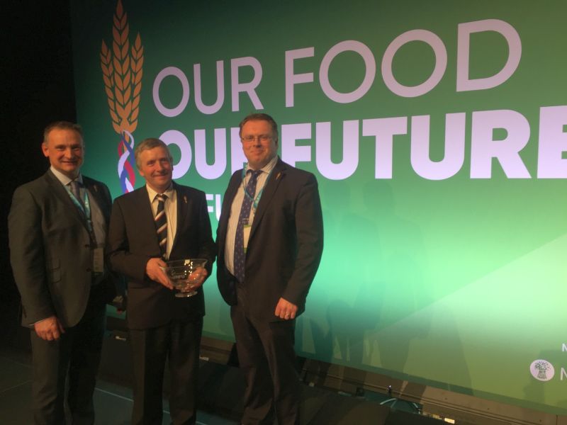 Lancashire farmer John Alpe (centre) has been honoured for his grassroots commitment to the NFU