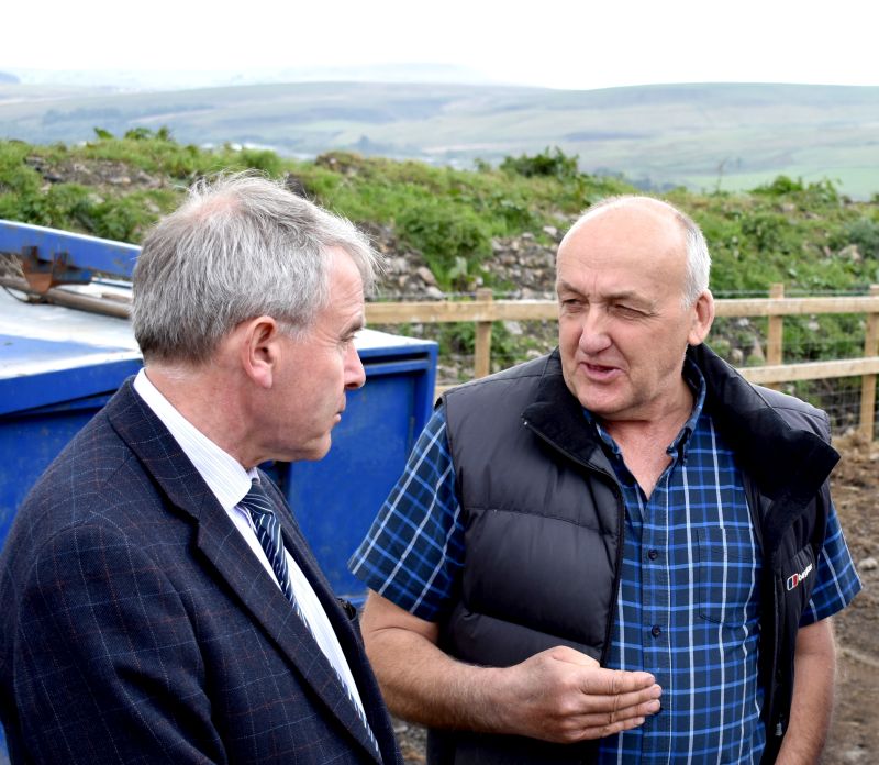 Defra's farming minister Robert Goodwill (L) visited a family farm in South Wales