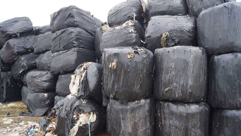 Waste is compressed into a block or ‘bale’ and concealed by plastic strapping