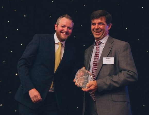 David Cotton (R), a fourth generation farmer, received the award for his dedication to the dairy industry