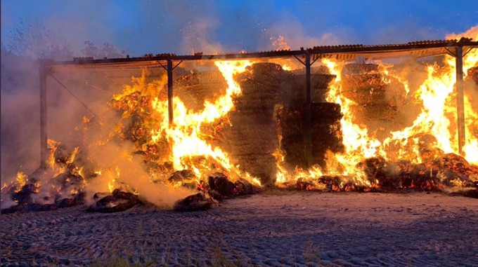 The blaze destroyed outbuildings and hundreds of tonnes of hay (Photo: Hardley Fire Station)