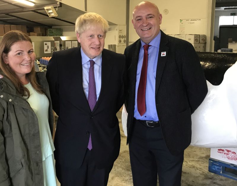 Boris Johnson with local farmer Victoria Shervington-Jones and NFU Cymru President, John Davies during yesterday's visit to Welsh farming businesses