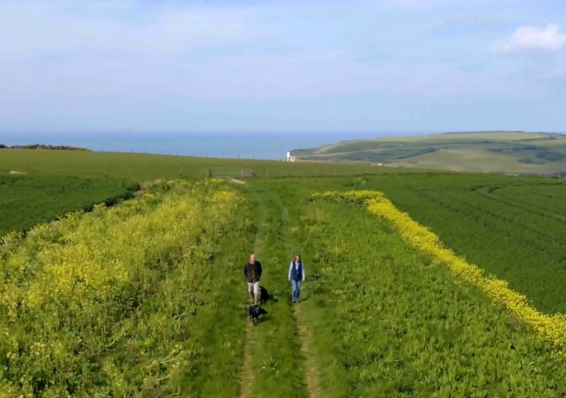 Holding a phone over the plaque, or reading the QR code, will reveal the film introducing the farmer responsible for caring for that stretch of land