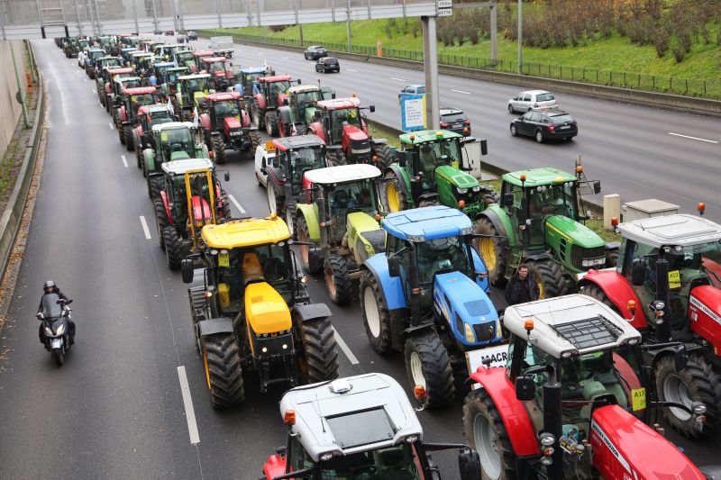 French farmers block the Parisian ring road with their tractors displaying placards reading 'Macron, answer!' as part of a protest against government policies (Photo: MUSTAFA SEVGI/SIPA/Shutterstock)