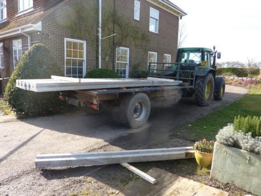 The business was fined after an employee fell from a trailer and was crushed to death by a concrete beam that fell with him