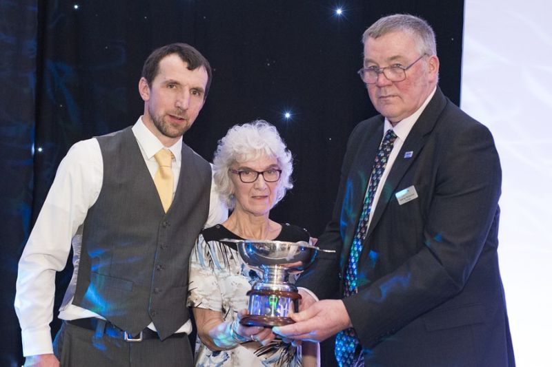 Jan Innes and son James collect the award from NFU Scotland President Andrew McCornick