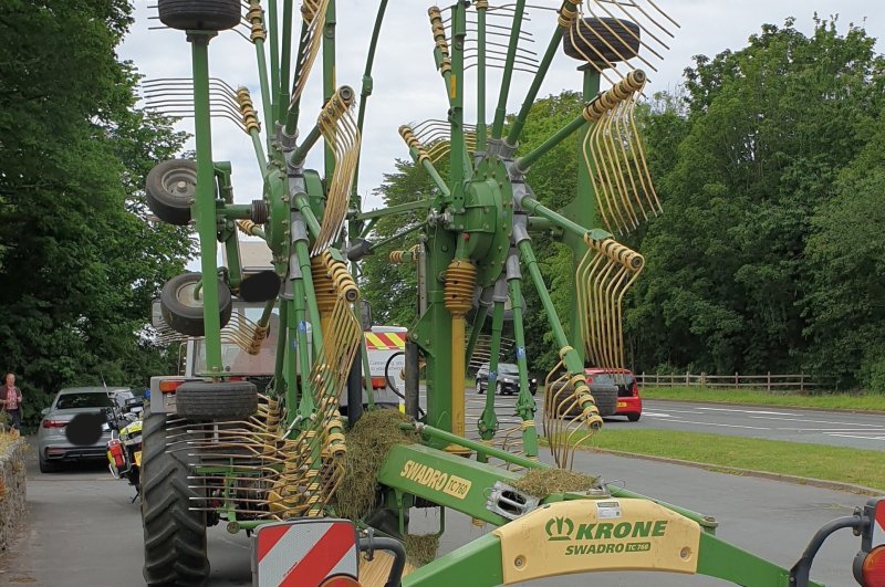 The farmer was caught using his mobile phone while driving a tractor pulling a rake (Photo: Cumbria Roads Police/Twitter)