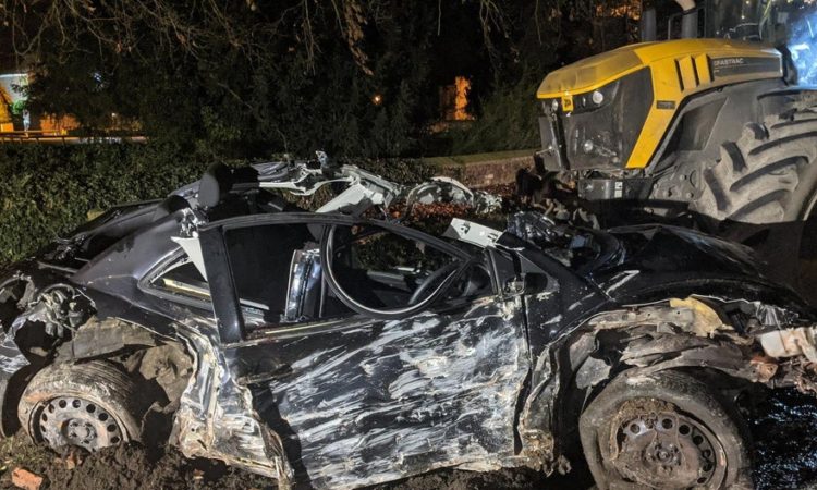 The JCB ended up on top of the car, trapping a passenger (Photo: N Yorkshire Police Roads Policing Group)