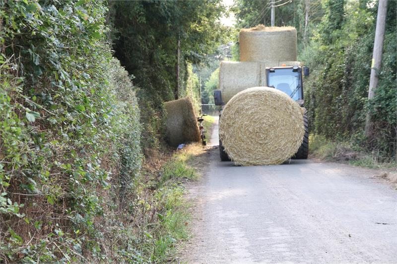 The farm worker failed to properly secure a load of straw bales