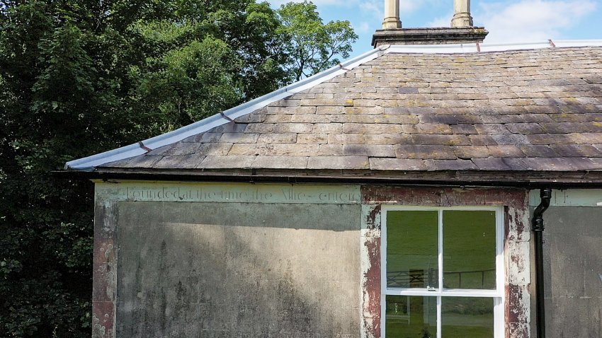 The farmhouse features an inscription commemorating the defeat of Napoleon