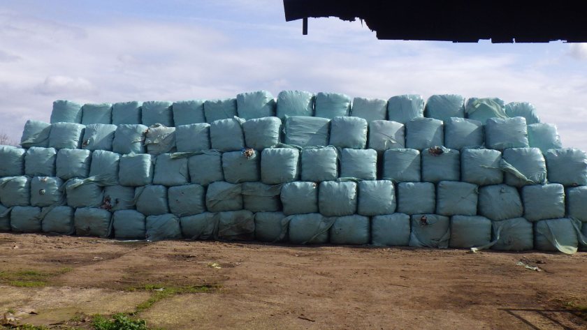 Plastic-wrapped bales of waste stacked at one of the illegal rural dumping sites (Photo: EA)