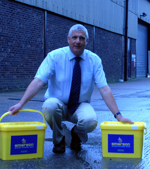 LES DAUBNEY WITH THE NEW BUCKETS OF EMERSON OILSEED RAPE READY FOR DELIVERY TO FARMERS