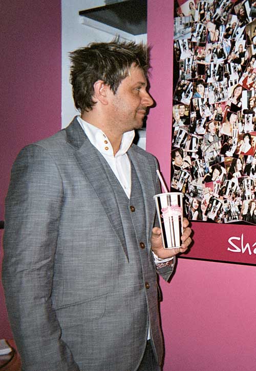 Ian Philpott and the Wall of Fame in the milk bar in Old Eldon Square, Newcastle.