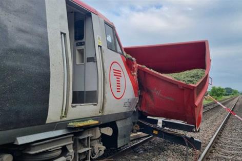 Train hit farm trailer after signaller forgot approaching service